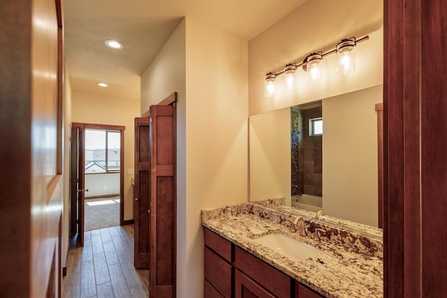 60874 Westview Dr, Nine Mile Falls, WA 99026 - full bathroom featuring wood finished floors, recessed lighting, vanity, a bathtub, and baseboards