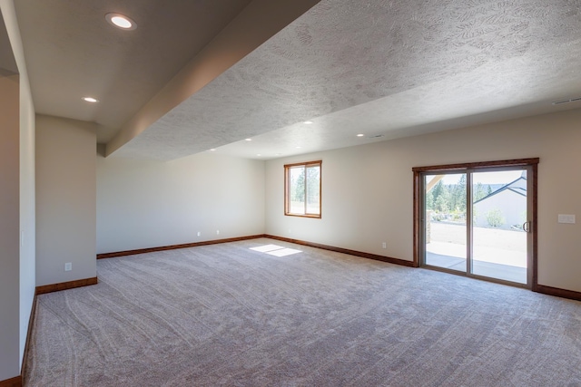 60874 Westview Dr, Nine Mile Falls, WA 99026 - carpeted empty room featuring baseboards, recessed lighting, and a textured ceiling