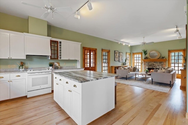 4408 E Spangle Creek Rd, Valleyford, WA 99036 - kitchen featuring rail lighting, white electric stove, ceiling fan, and light wood finished floors
