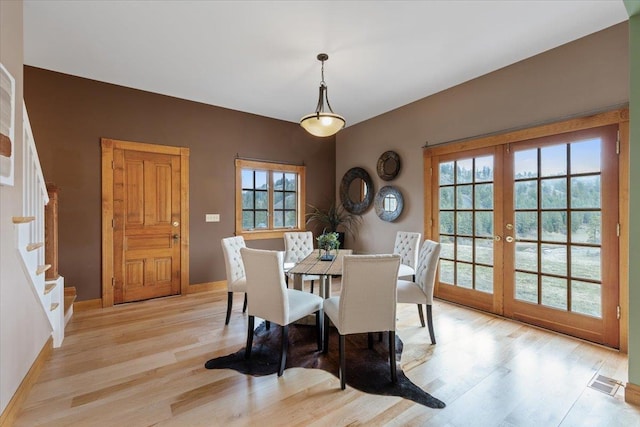 4408 E Spangle Creek Rd, Valleyford, WA 99036 - dining area with french doors, wood finished floors, baseboards, and stairway