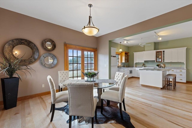 4408 E Spangle Creek Rd, Valleyford, WA 99036 - dining area with light wood finished floors, a ceiling fan, baseboards, and rail lighting