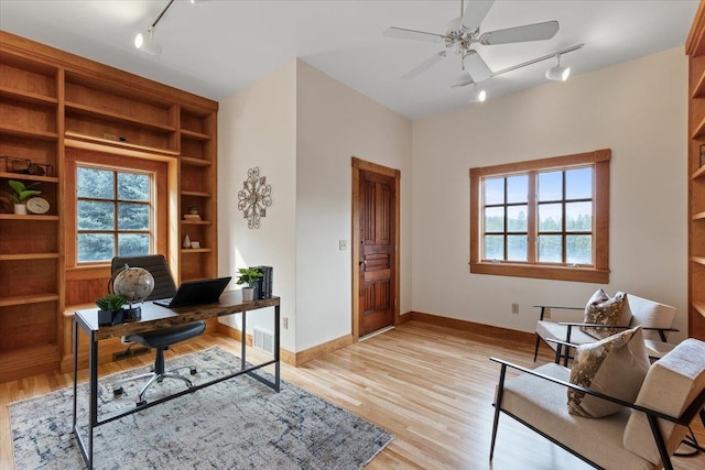 4408 E Spangle Creek Rd, Valleyford, WA 99036 - office space featuring track lighting, ceiling fan, plenty of natural light, and light wood finished floors