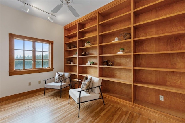 4408 E Spangle Creek Rd, Valleyford, WA 99036 - sitting room with rail lighting, wood finished floors, baseboards, and ceiling fan