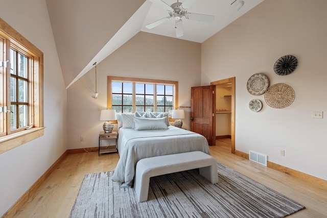 4408 E Spangle Creek Rd, Valleyford, WA 99036 - bedroom with light wood finished floors, baseboards, high vaulted ceiling, and a ceiling fan
