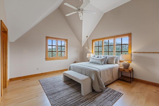 4408 E Spangle Creek Rd, Valleyford, WA 99036 - bedroom with light wood-style floors, baseboards, lofted ceiling, and a ceiling fan