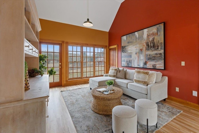 4408 E Spangle Creek Rd, Valleyford, WA 99036 - living room featuring wood finished floors, high vaulted ceiling, and baseboards