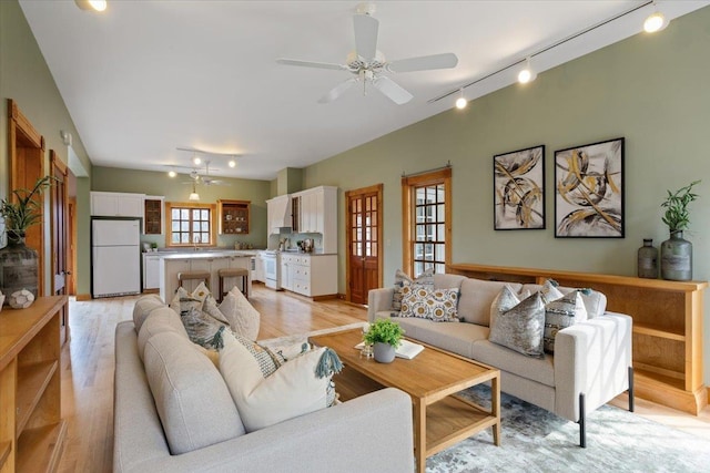 4408 E Spangle Creek Rd, Valleyford, WA 99036 - living room with track lighting, light wood-style floors, and a ceiling fan