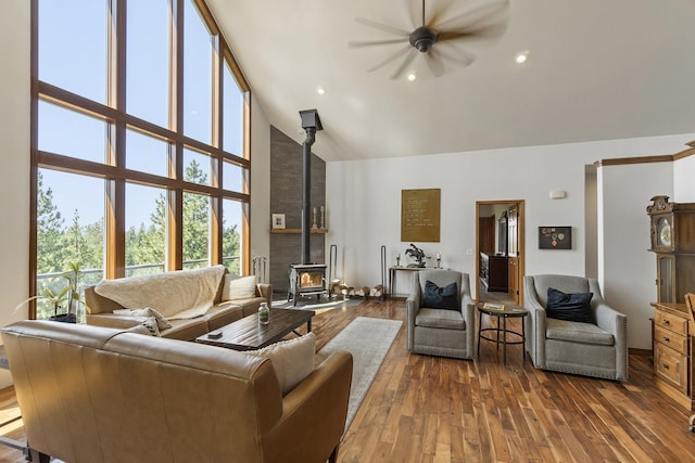 12715 E Deer Creek Rd, Chattaroy, WA 99003 - living area with a wood stove, high vaulted ceiling, a ceiling fan, wood finished floors, and recessed lighting