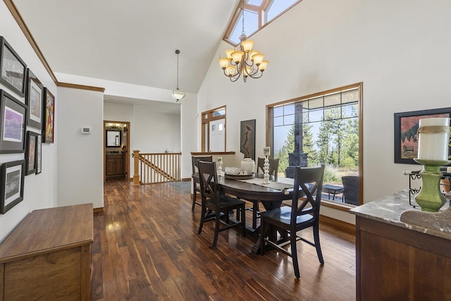12715 E Deer Creek Rd, Chattaroy, WA 99003 - dining space with high vaulted ceiling, plenty of natural light, dark wood finished floors, and a chandelier