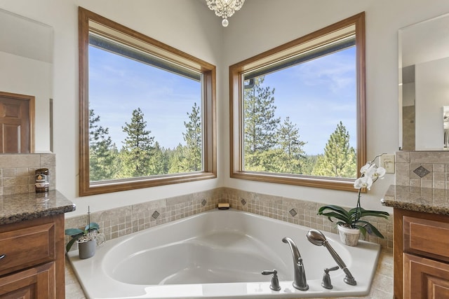 12715 E Deer Creek Rd, Chattaroy, WA 99003 - bathroom featuring vanity and a garden tub