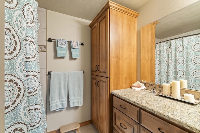 12715 E Deer Creek Rd, Chattaroy, WA 99003 - full bath with tile patterned floors, a shower with shower curtain, and vanity