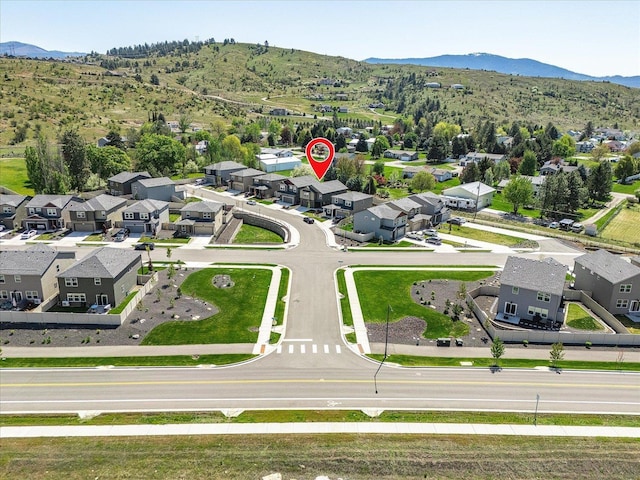 aerial view of residential area with mountains