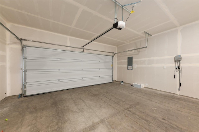 garage featuring a garage door opener and electric panel