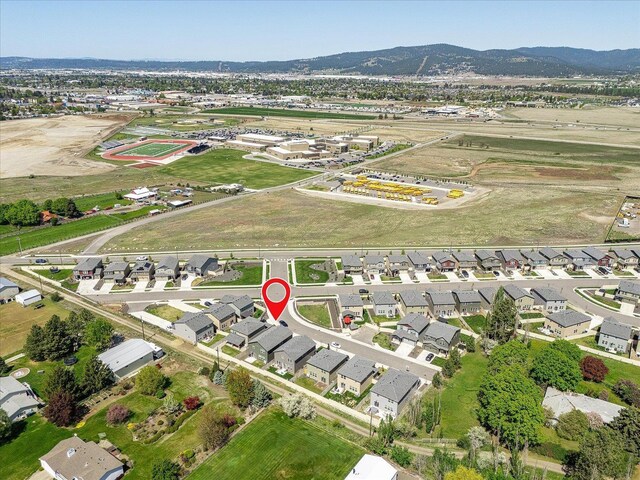 aerial overview of property's location featuring a mountainous background