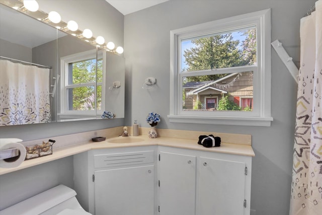 full bath with vanity and toilet
