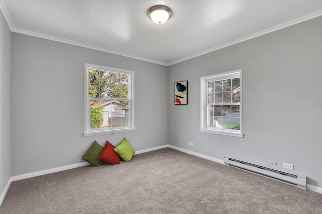 unfurnished room featuring baseboard heating, healthy amount of natural light, carpet, ornamental molding, and baseboards