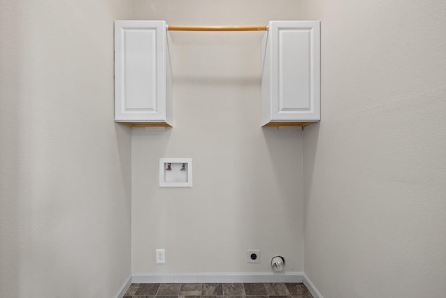 laundry room with cabinet space, washer hookup, baseboards, and hookup for an electric dryer