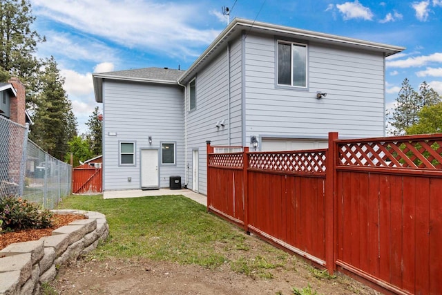 rear view of house with a patio area and central AC unit