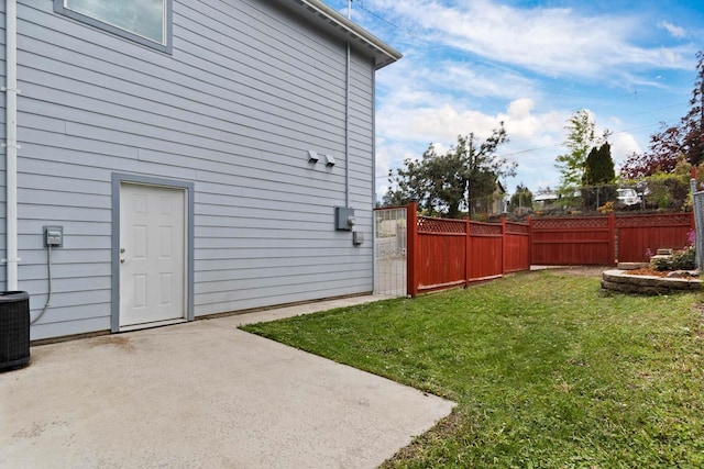 view of yard with a patio and central AC