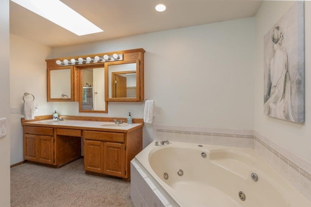 4414 Garden Spot Rd, Clayton, WA 99110 - bathroom featuring a skylight, double vanity, a whirlpool tub, and recessed lighting