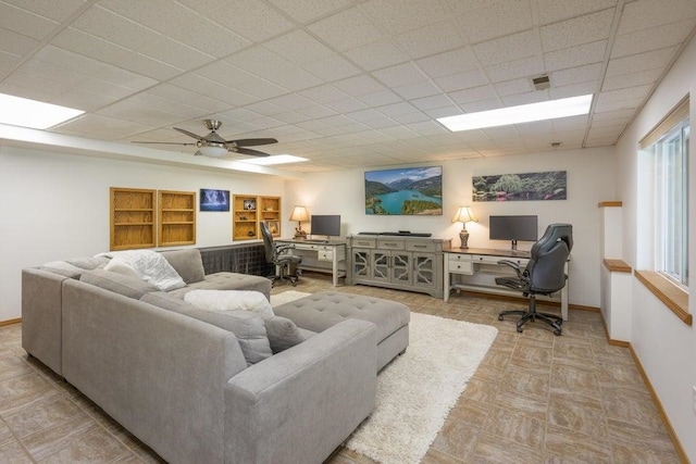 4414 Garden Spot Rd, Clayton, WA 99110 - living area with baseboards, a paneled ceiling, and ceiling fan