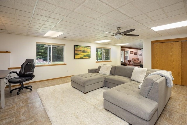 4414 Garden Spot Rd, Clayton, WA 99110 - living room featuring ceiling fan, a paneled ceiling, and baseboards