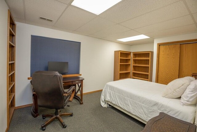 4414 Garden Spot Rd, Clayton, WA 99110 - carpeted bedroom with a drop ceiling, baseboards, an office area, and a closet