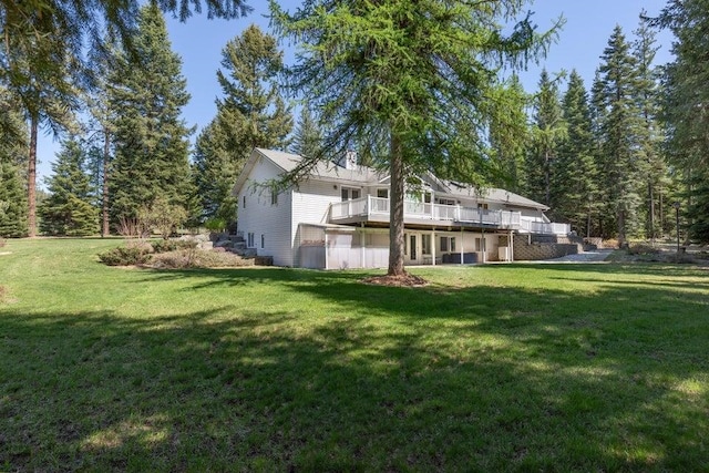4414 Garden Spot Rd, Clayton, WA 99110 - rear view of house featuring a yard and a wooden deck