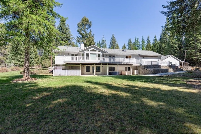 4414 Garden Spot Rd, Clayton, WA 99110 - rear view of house with a wooden deck, a lawn, and a chimney