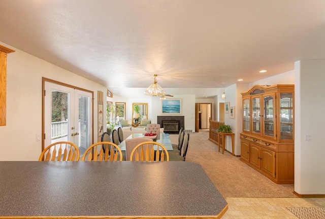 4414 Garden Spot Rd, Clayton, WA 99110 - dining space with a fireplace, french doors, a chandelier, recessed lighting, and baseboards