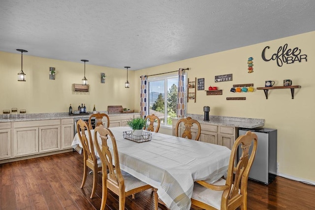 5612 N Vista Grande Dr, Otis Orchards, WA 99027 - dining space featuring dark wood-style flooring, a textured ceiling, and bar with sink