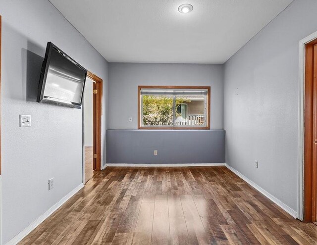 5612 N Vista Grande Dr, Otis Orchards, WA 99027 - unfurnished bedroom featuring wood finished floors and baseboards