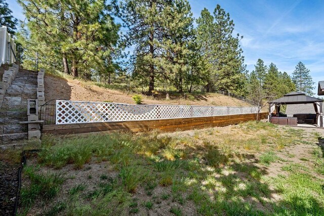 5612 N Vista Grande Dr, Otis Orchards, WA 99027 - fenced backyard with a gazebo