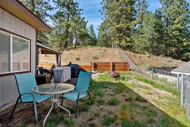 5612 N Vista Grande Dr, Otis Orchards, WA 99027 - view of yard featuring fence and an outdoor fire pit
