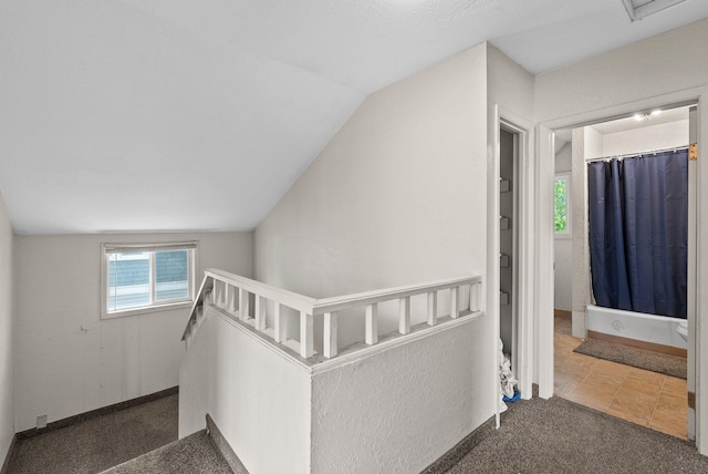 2124 N Dakota St, Spokane, WA 99207 - hall featuring an upstairs landing, vaulted ceiling, carpet floors, and baseboards