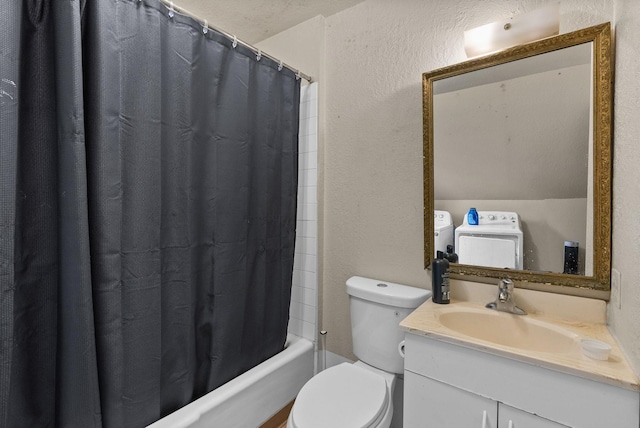 2124 N Dakota St, Spokane, WA 99207 - bathroom featuring toilet, washing machine and clothes dryer, a textured wall, vanity, and shower / bathtub combination with curtain