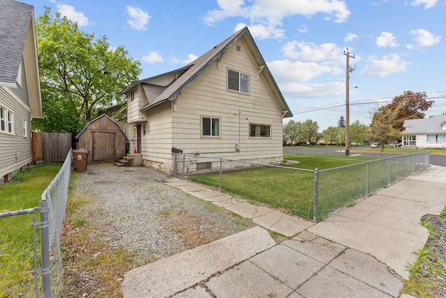 2124 N Dakota St, Spokane, WA 99207 - view of home's exterior featuring a shed, an outbuilding, and gravel driveway