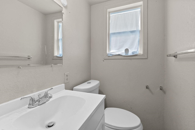 2124 N Dakota St, Spokane, WA 99207 - half bath with healthy amount of natural light, toilet, and vanity