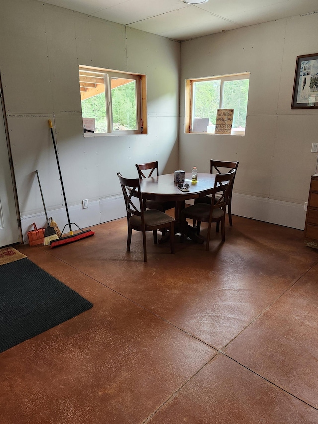 dining room with concrete floors