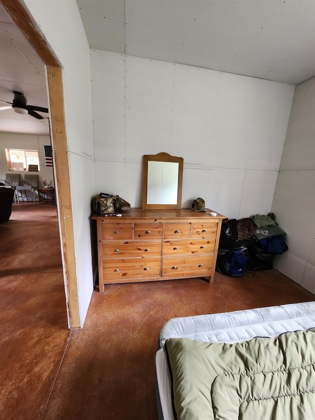 bedroom featuring concrete flooring