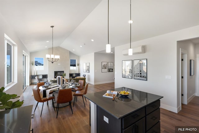 5741 S Sherri Lea Rd, Spokane, WA 99224 - kitchen featuring dark wood-style floors, dark countertops, open floor plan, a kitchen island, and high vaulted ceiling