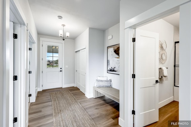 5741 S Sherri Lea Rd, Spokane, WA 99224 - mudroom with baseboards, light wood-type flooring, and a chandelier