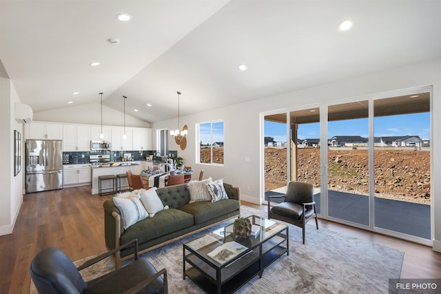 5741 S Sherri Lea Rd, Spokane, WA 99224 - living area with vaulted ceiling, dark wood-style flooring, a chandelier, recessed lighting, and baseboards