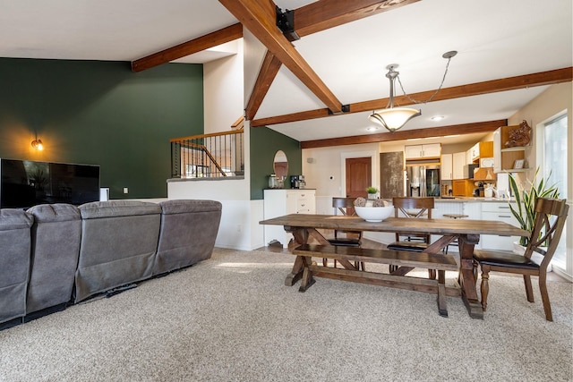 dining room featuring beamed ceiling, light carpet, stairway, and recessed lighting