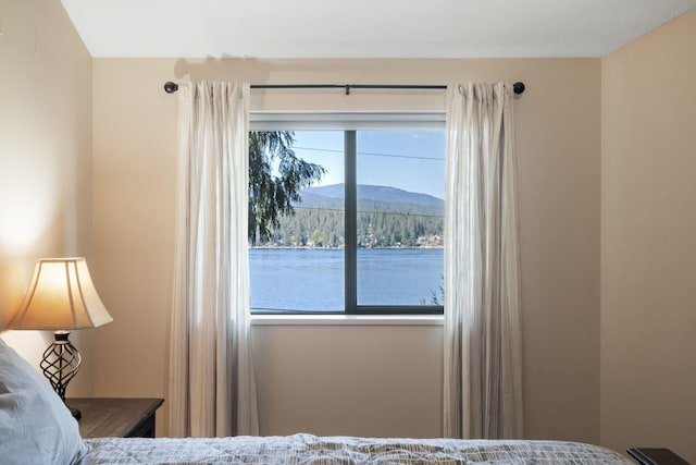 bedroom featuring a mountain view