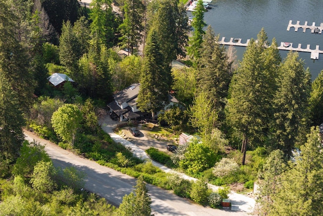aerial view of property and surrounding area with a nearby body of water