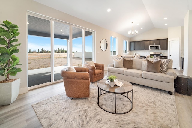 5763 S Sherri Lea Rd, Spokane, WA 99224 - living room featuring a chandelier, light wood-type flooring, vaulted ceiling, and recessed lighting