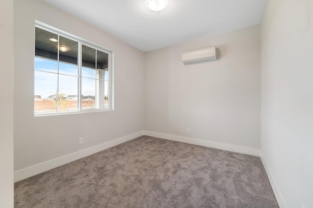 5763 S Sherri Lea Rd, Spokane, WA 99224 - spare room featuring an AC wall unit, carpet flooring, and baseboards