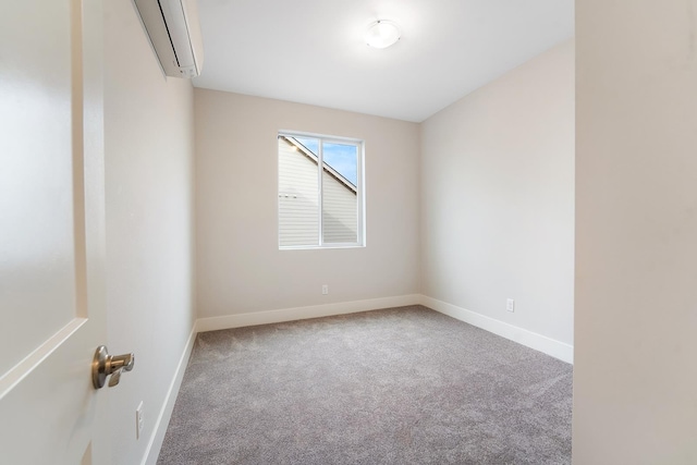 5763 S Sherri Lea Rd, Spokane, WA 99224 - spare room with a wall unit AC, carpet flooring, and baseboards