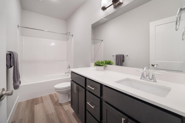 5763 S Sherri Lea Rd, Spokane, WA 99224 - bathroom featuring wood finished floors, toilet, tub / shower combination, and vanity